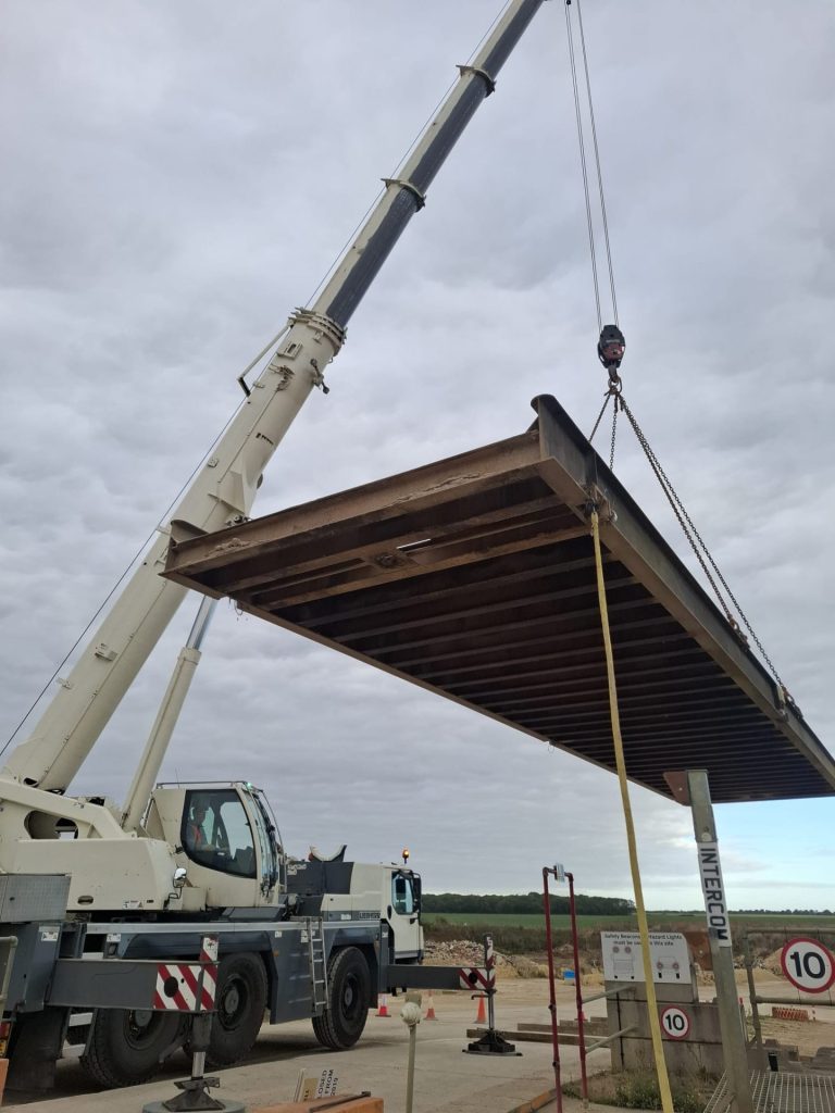 Mobile crane installing timber roof structure